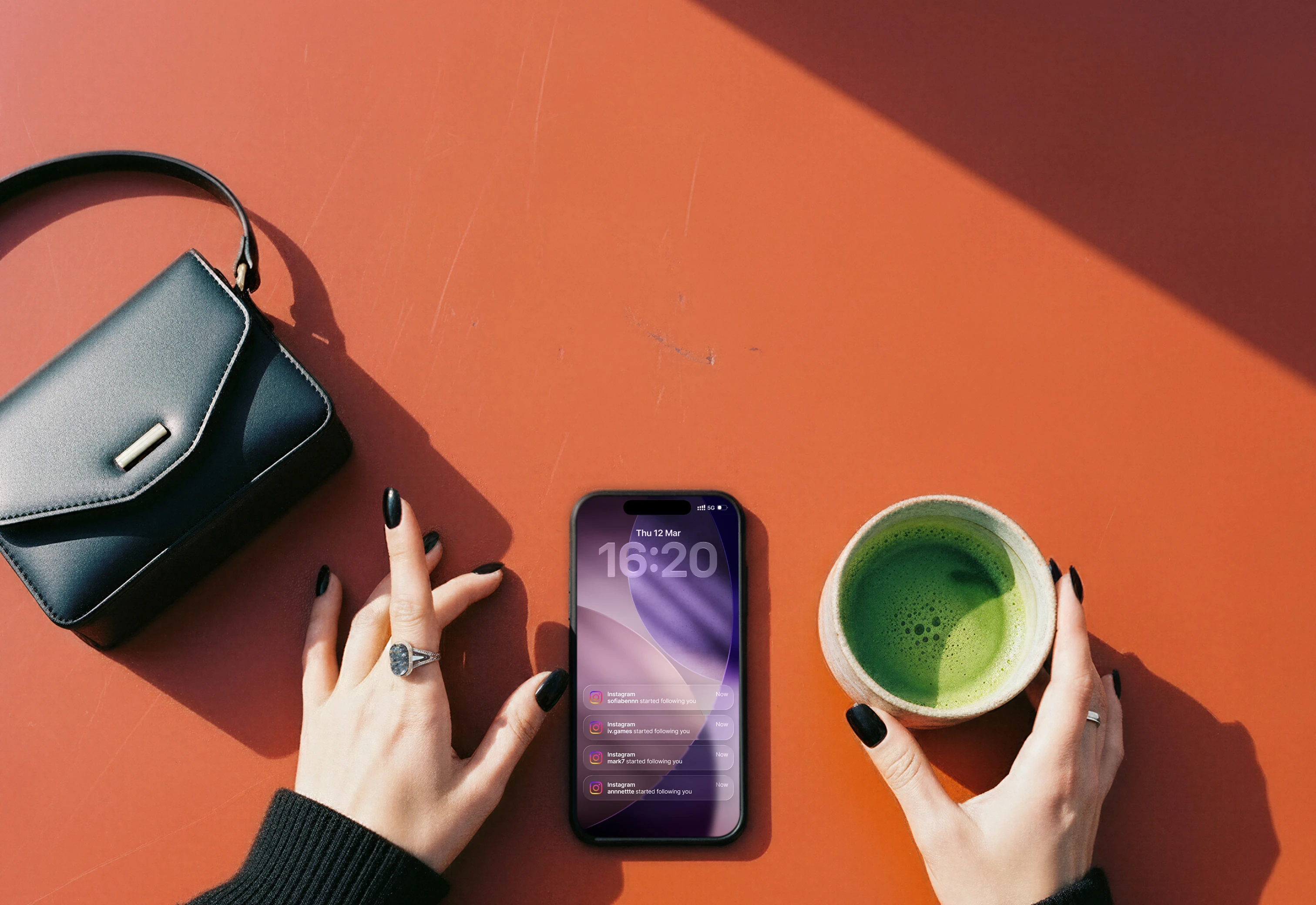 Phone on the table with a matcha latte